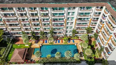 an aerial view of an apartment building with a swimming pool at OMNIAPHUKET - Patong Center Pool Gym Near Bangla Road in Patong Beach