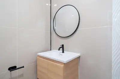 a bathroom with a sink and a mirror at Wink 3 Patong Beach Phuket sleep 8 in Patong Beach