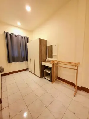 a kitchen with a refrigerator and a tiled floor at Home Hug local stay Bangtao in Bang Tao Beach
