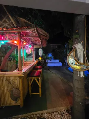 a night view of a bird house with lights at Leon Oasis Nai Harn in Rawai Beach