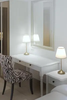 a white desk with a chair and a mirror at Suite Velora 3BR Pool GymCassia Laguna Phuket in Laguna Phuket