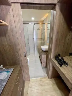 a bathroom with a shower and a toilet and a sink at Sea Breeze 2 Bedrooms Rawai Naiharn Beach in Rawai Beach