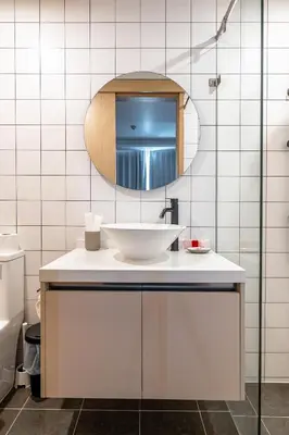 a bathroom with a sink and a mirror at Suite Blue Horizon 2BR Sea View Fantasea Kamala in Kamala Beach