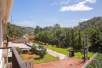 a view of a park from the balcony of a building at LAGO APARTMENTS BY TROPICLOOK in Nai Harn Beach