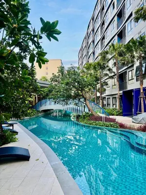 a swimming pool in the middle of a building at Poolside Paradise, Nice pool view in Kathu