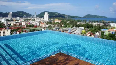 a swimming pool with a view of a city at Sea view apartment in Phuket in Patong Beach