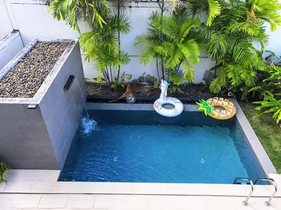 a swimming pool in a backyard with a pool noodle pool at \u65e0\u5c18\u522b\u9662 Pure Haven Villa in Ban Phru Champa
