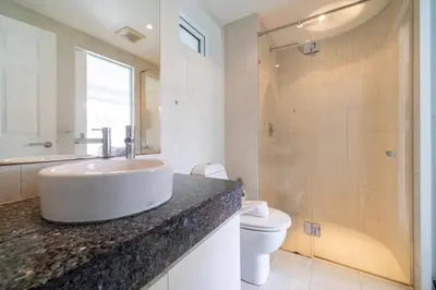 a bathroom with a sink and a toilet at Kata Ocean View I05 in Karon Beach