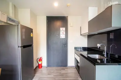 a kitchen with a stainless steel refrigerator and a sink at \u82ad\u4e1cTheDeck220\u7cbe\u88c5\u4e00\u5367\u5ba4\u516c\u5bd3 \u8fd1\u82ad\u4e1c\u6d77\u6ee9Bangla\u6c5f\u897f\u51b7 in Patong Beach