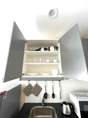 a kitchen with a sink and a shelf with utensils at С12 Title Naiyang Ватсап669З5В2I976 in Nai Yang Beach