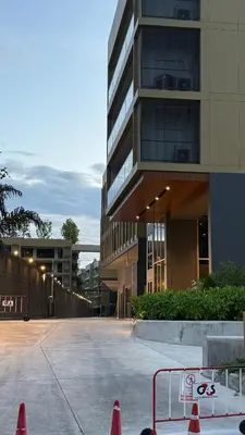 a parking lot in front of a building with orange cones at Lux apartment 100 sqm in Laguna in Bang Tao Beach