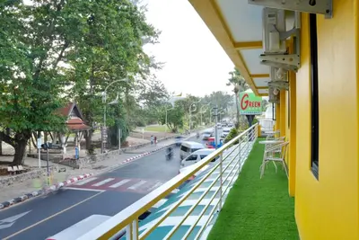 a view of a street from a balcony of a building at Bed & Beach Hostel Karon in Karon Beach