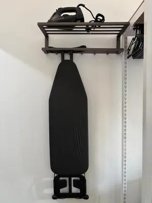 a black object is hanging on a wall at Sachi Minimal House Bangtao Beach - Near Muay Thai Gym in Surin Beach