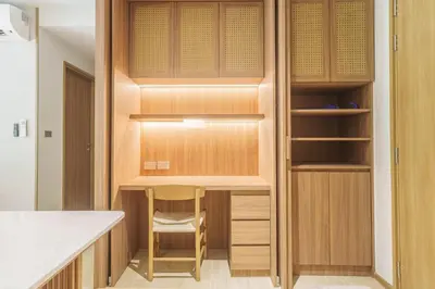 a closet with a desk and a chair in a kitchen at Laguna Beachfront 3BR Cozy Condo in Bang Tao Beach