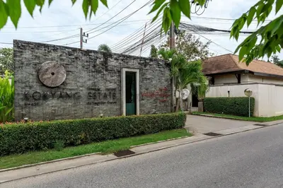 a brick building with a face painted on it at Villa Haeata 3BR Private Pool Nai Harn Beach in Nai Harn Beach
