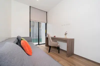 a room with a couch and a desk and a table at The Exclusive Sky D1 \u8c6a\u534e4\u5367\u5ba4\u6d77\u666f\u522b\u5885 \u79c1\u4eba12m\u65e0\u8fb9\u6d77\u666f\u6cf3\u6c60 \u6bcf\u65e5\u6e05\u6d01 in Kamala Beach