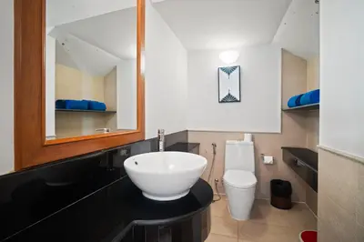 a bathroom with a white sink and a toilet at Laguna Village 2 Bedroom Pool View Villa by Banyan Living in Layan Beach