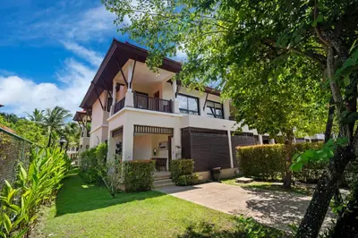 an exterior view of a house with a yard at Laguna Village 2 Bedroom Pool View Villa by Banyan Living in Layan Beach