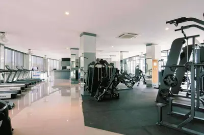 a gym with treadmills and machines in a building at Tropical Kamala Hill View 1 BR CTG P407 in Kamala Beach
