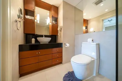 a bathroom with a white toilet and a sink at Stylish Thai 2BR Condo Pool & Golf with Balcony in Laguna Phuket
