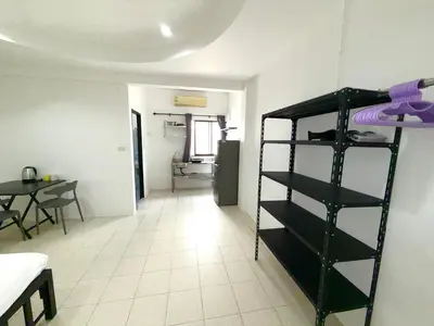 a room with a bunk bed and a dining room at Patong Canal Villa 108 in Patong Beach