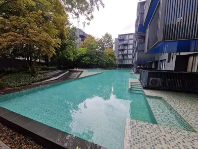 a swimming pool in the middle of a building at The Deck Condo Patong Mountain View1 in Patong Beach