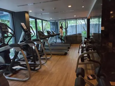a gym with rows of treadmills at The Deck Condo Patong Mountain View1 in Patong Beach