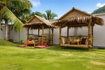 a gazebo with chairs and tables in a yard at Kamala Beach Phuket - 4BR Private Luxury Pool Villa with Maid in Kamala Beach