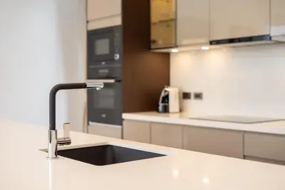 a kitchen with a sink and a counter top at Breeze Villa - Luxury Relaxation in Phuket in Ban Thalat Choeng Thale