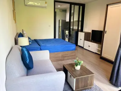 a living room with a bed and a couch at The Base Central Phuket-B2-Y9B in Ban Rangeng