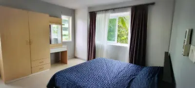 a bedroom with a blue bed and a window at Supalai Park Phuket City 2 bedrooms for rent in Phuket Town