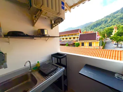 a kitchen with a sink and a view of a city at Patong Canal Villa 305 in Patong Beach