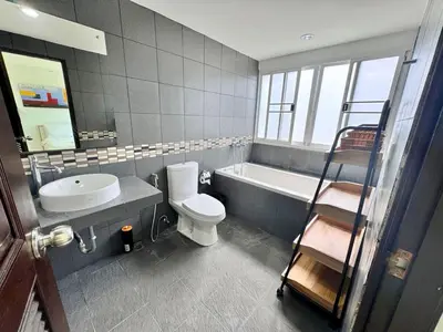 a bathroom with a toilet and a sink and a ladder at Modern Kamala Townhouse Hideaway with Shared Pool in Kamala Beach