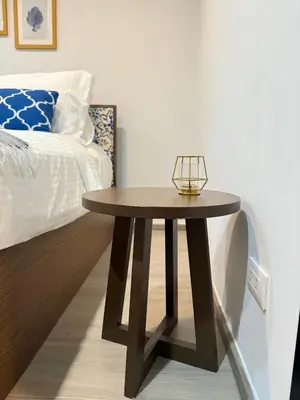 a wooden table in a bedroom with a bed at Luxury Resort Style 1 Bedroom Studio near Central in Phuket Town