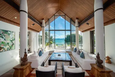 a living room with white furniture and large windows at Villa Serenity -30 meter Pool & 6 Bedroom with Cinema Room and Gym in Ko Lek