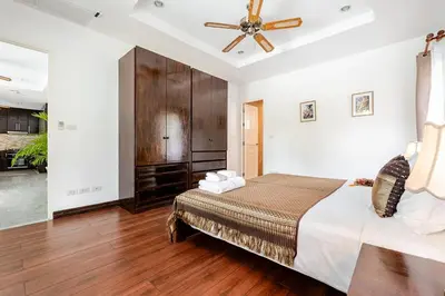 a bedroom with a bed and a ceiling fan at Cozy Pool Villa near Kamala - 12 min to the Beach in Kamala Beach