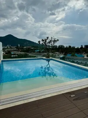a large swimming pool with a tree in the middle at Чудесная видовая квартира Fantasea пляж Камала in Kamala Beach