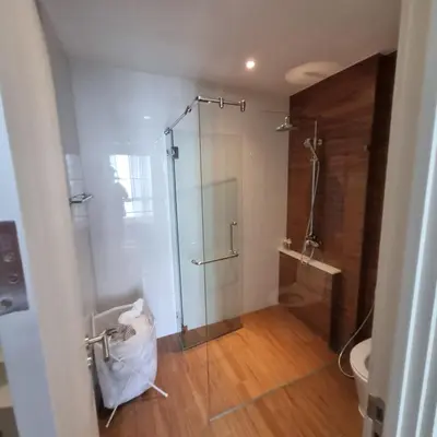 a bathroom with a glass shower and a toilet at Title Halo Nai Yang Тайтл Хало Най Янг operated by OK Group in Nai Yang Beach
