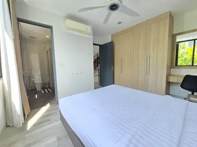 a bedroom with a white bed and a ceiling fan at Laguna Park 2 Villa 3 bedroom in Ban Phru Champa