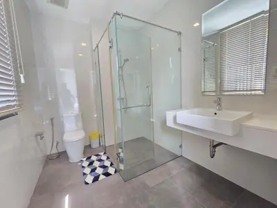 a bathroom with a glass shower and a sink at Laguna Park 2 Villa 3 bedroom in Ban Phru Champa