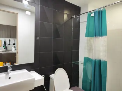 a bathroom with a sink and a toilet and a shower at 6 Floor - Studio room at OZC near Kata beach in Kata Beach