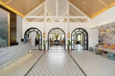 a lobby of a villa with a living room at Howard Johnson by Wyndham Phuket Naiyang in Thalang