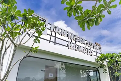 a sign on top of a building with trees at Fantasea by Villacarte in Kamala Beach