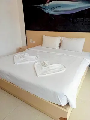a bed with white towels on top of it at XX GO Inn Krabi Aonang Beach - โกอินน์ อ่าวนาง in Ban Khlong Haeng