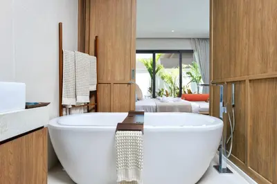 a bathroom with a large white tub in a room at Lerka Villa Elegant 3 Bedroom in Rawai Beach