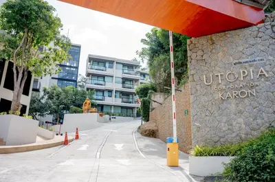 an empty street in front of a building at Utopia Karon - Karon Beach in Karon Beach