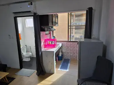 a small bathroom with a sink and a toilet at Monkey Apartment 3 in Patong Beach
