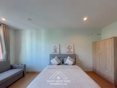 a small bedroom with a bed and a couch at THe bell chalong phuket 19 in Ban Klang