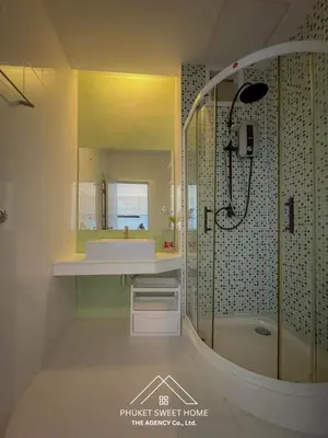 a bathroom with a sink and a shower at THe bell chalong phuket 19 in Ban Klang