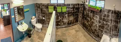 a bathroom with a shower and a toilet and a sink at Serenity Holiday Pool Villa, Bangtao Beach in Surin Beach